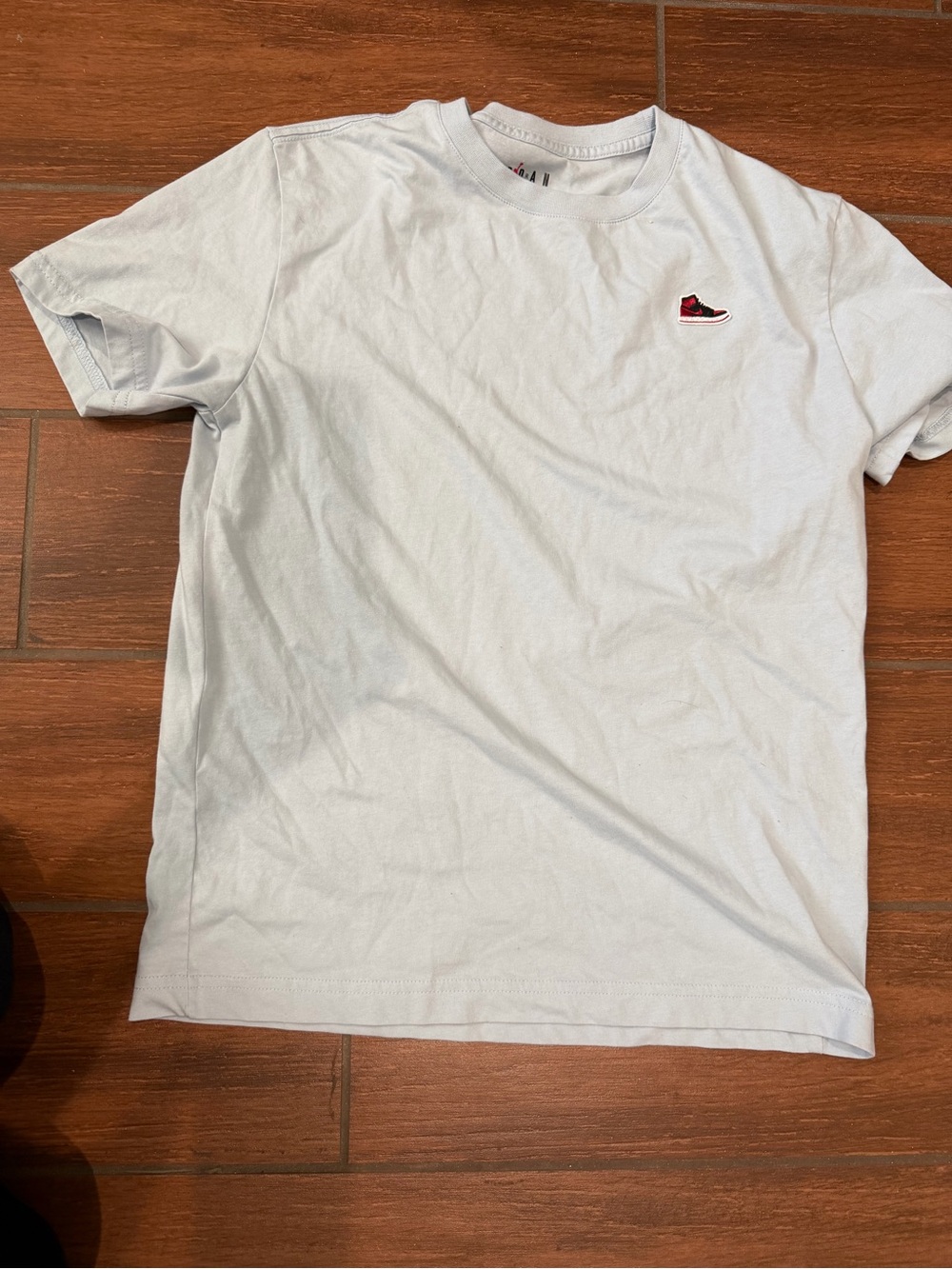 Youth Jordan Light Blue Crewneck Tee with Red Sneaker Patch